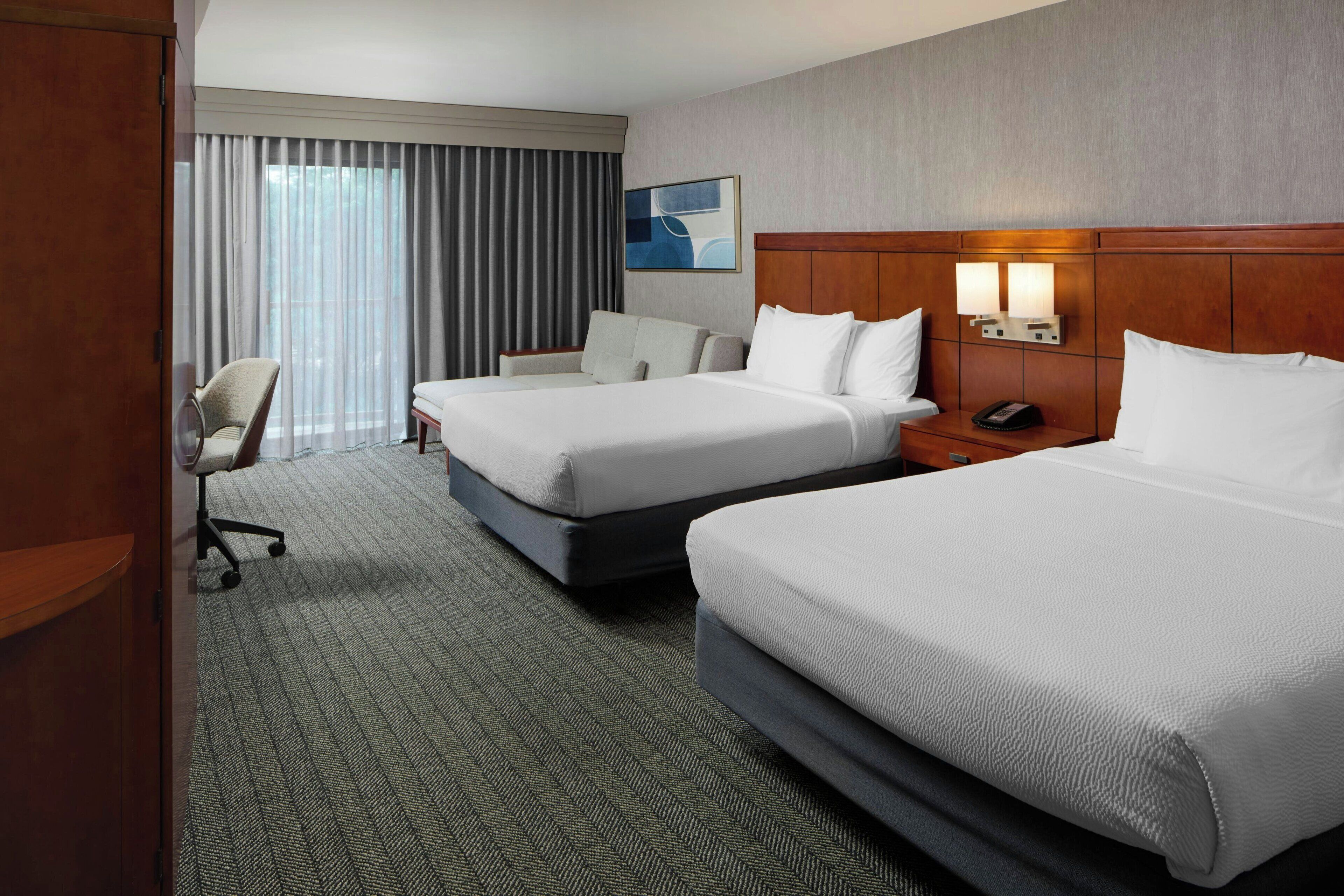 Hypo-allergenic bedding, pillow-top beds, in-room safe, desk