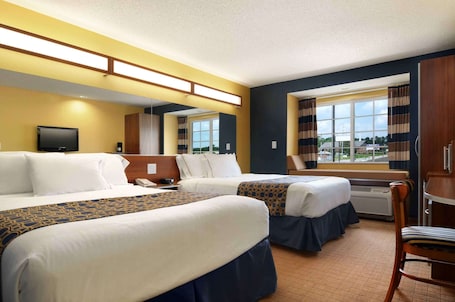 Desk, laptop workspace, blackout curtains, iron/ironing board. Microtel Inn & Suites by Wyndham Columbus/Near Fort Benning