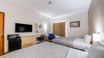 Ropa de cama de alta calidad y caja de seguridad en la habitación