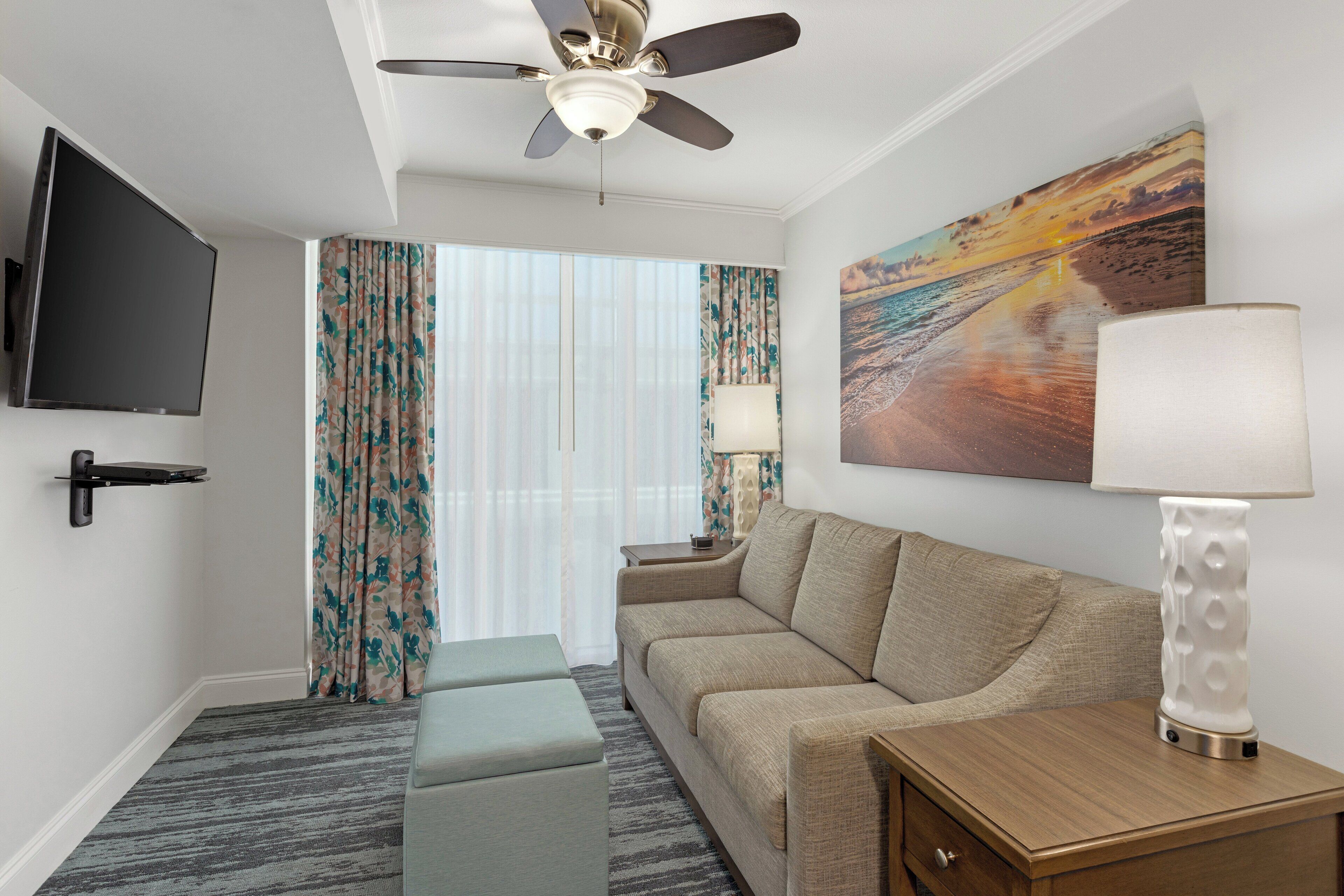 standard suite, 2 bedrooms | living area | lcd tv