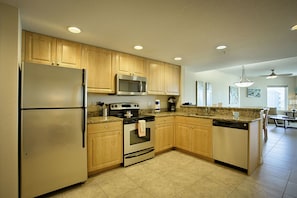 Suite, Multiple Beds, Pool View (2 Bedroom Suite) | Private kitchen | Fridge, microwave, oven, stovetop