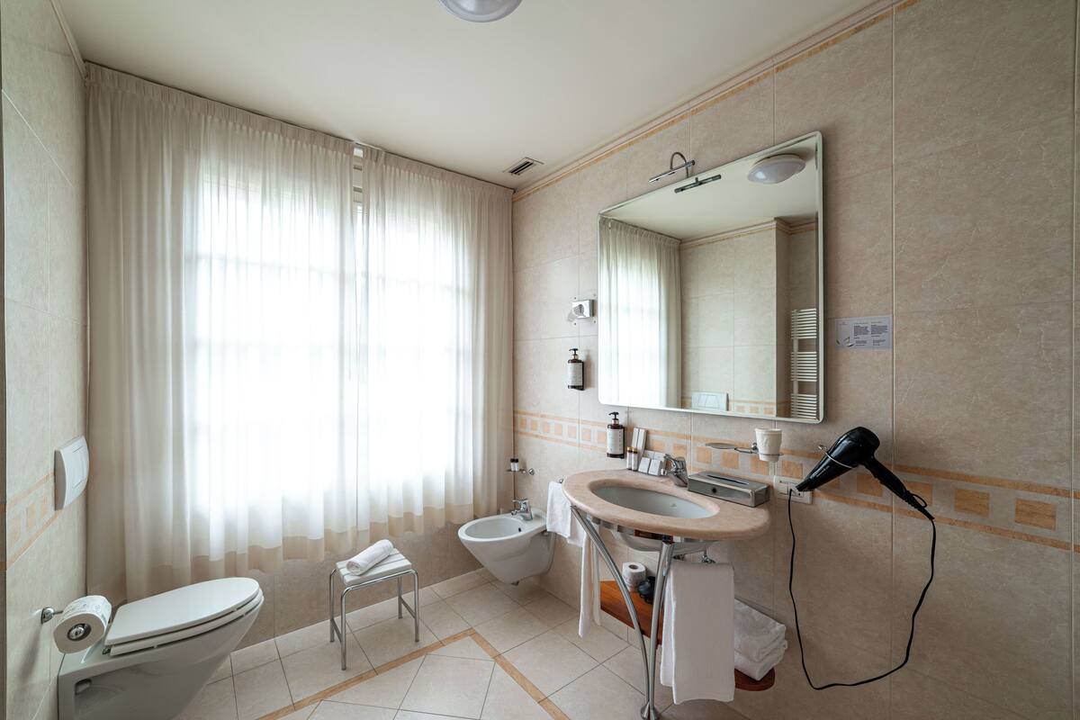 classic double or twin room | bathroom | shower, free toiletries, hair dryer, slippers