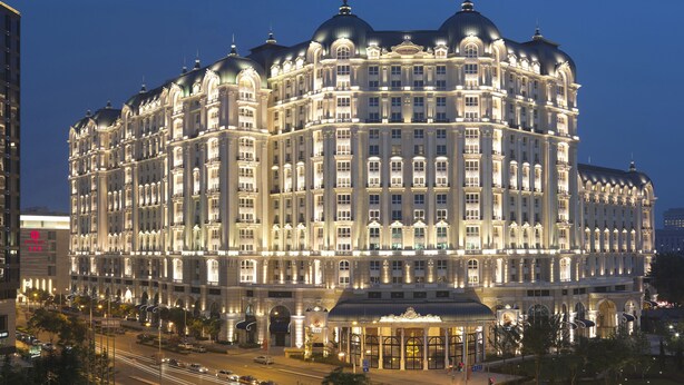 A large, ornate hotel with multiple floors and a grand entrance. - Legendale Hotel Beijing (Beijing)