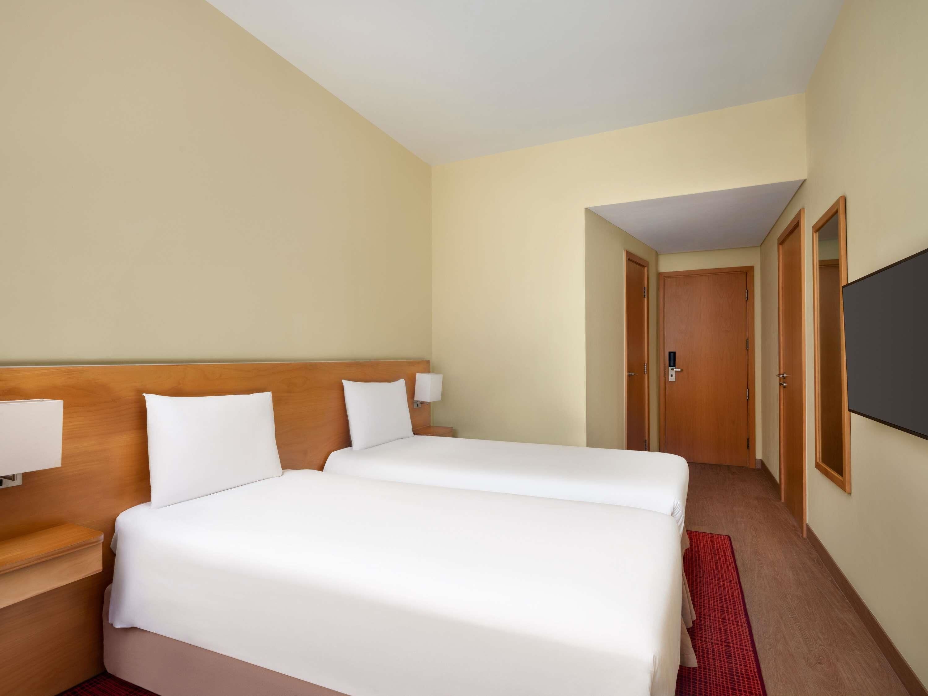 Room, 2 Twin Beds | Down comforters, individually furnished, desk, blackout drapes