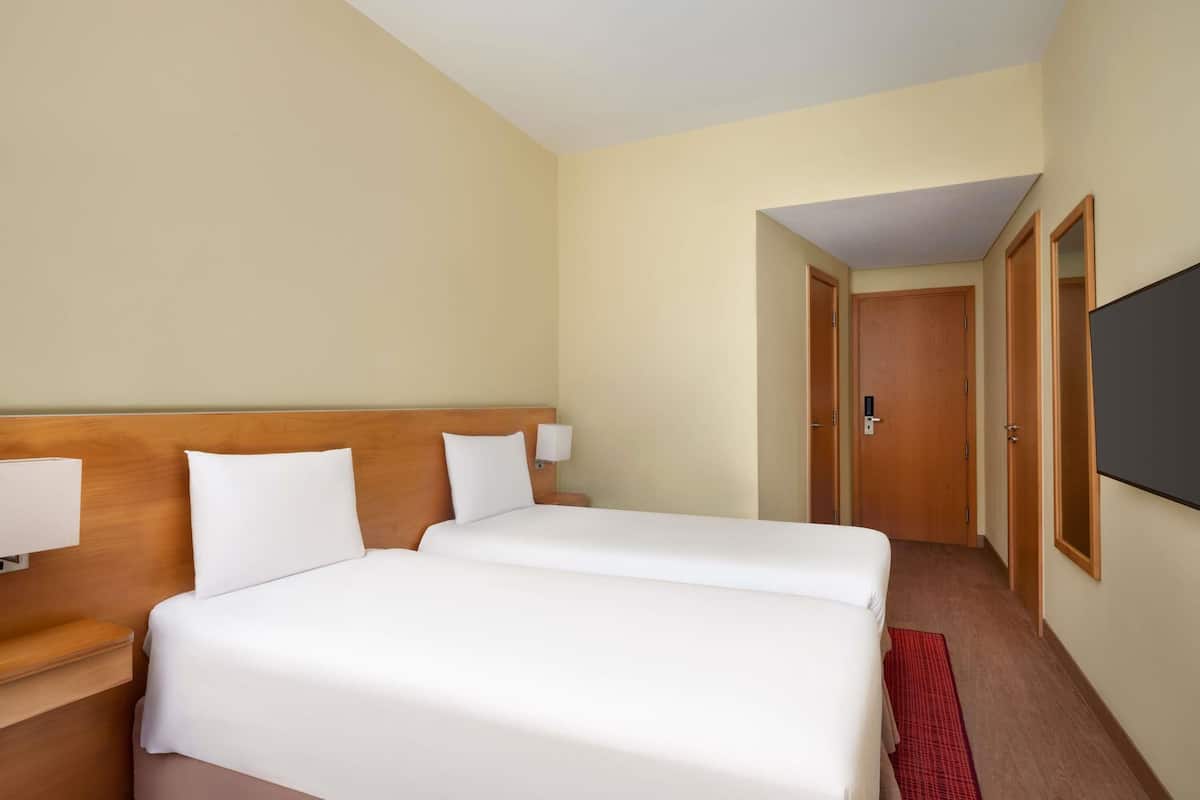 Room, 2 Twin Beds | Down comforters, individually furnished, desk, blackout drapes