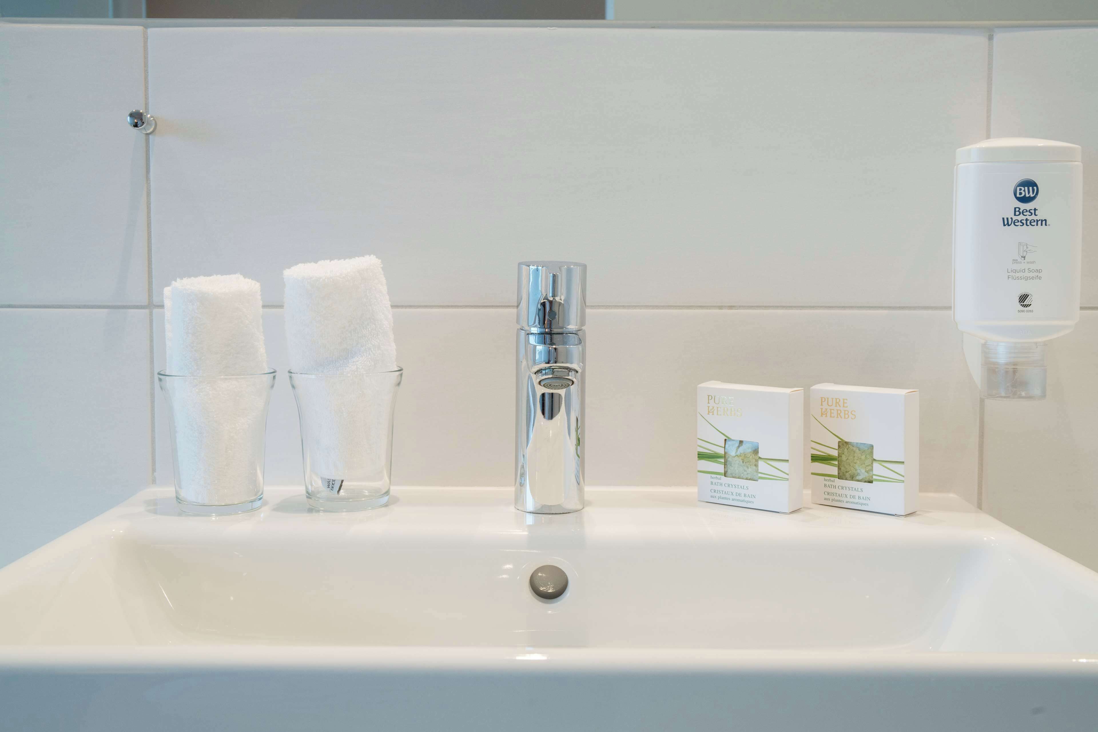 hair dryer, towels, soap, shampoo