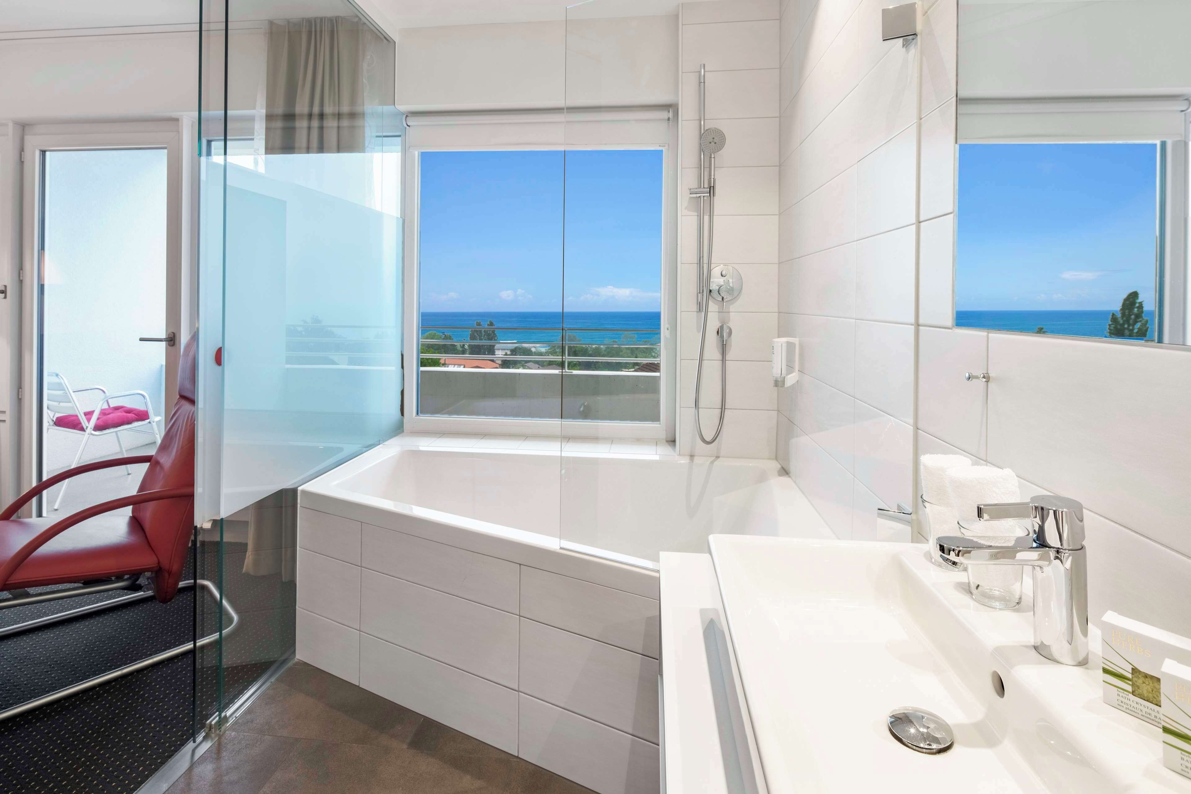 junior suite, 1 double bed, balcony, lake view | bathroom | hair dryer, towels, soap, shampoo