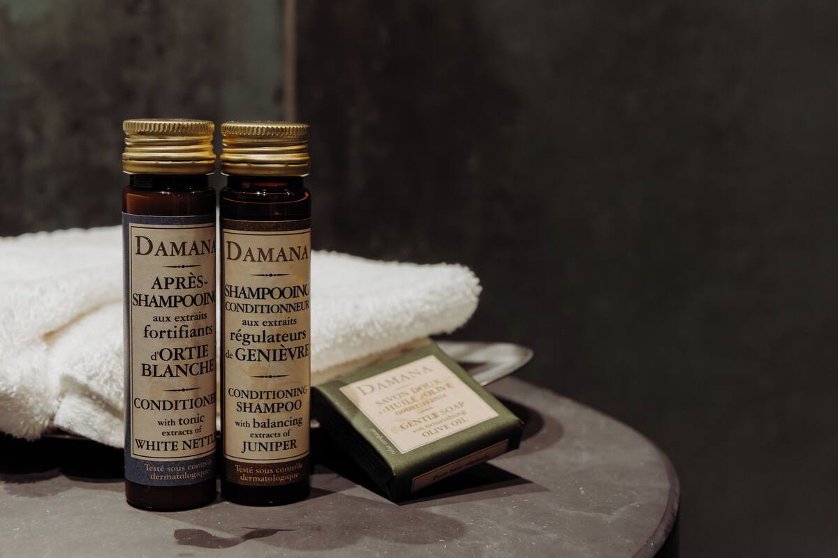 shower, designer toiletries, hair dryer, towels