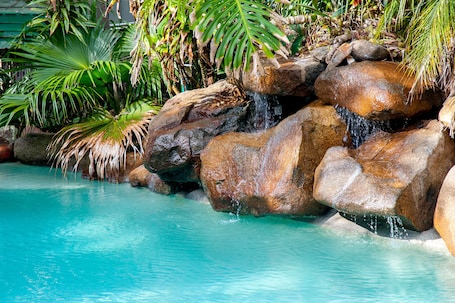 Seasonal outdoor pool, open 8:00 AM to 9:00 PM, pool umbrellas