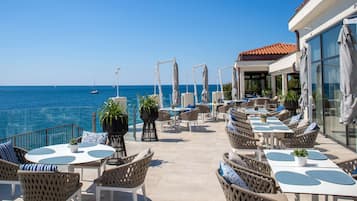 Breakfast, dinner served; international cuisine, beach views