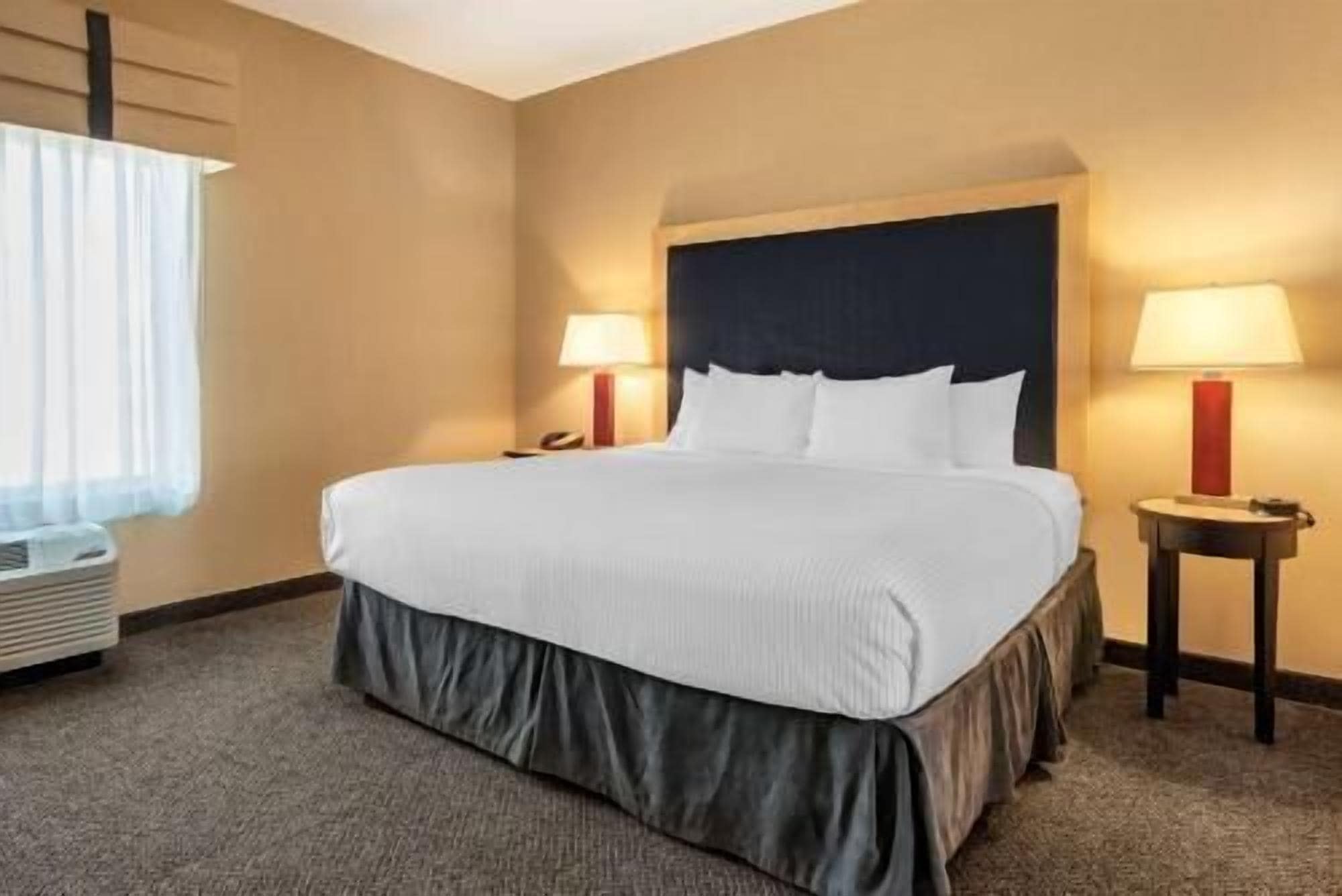 Premium bedding, pillow-top beds, desk, laptop workspace