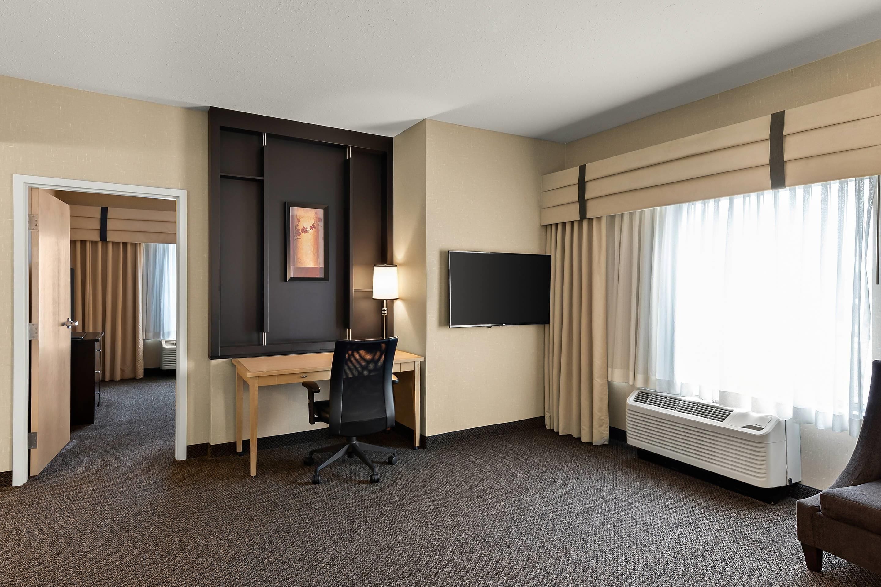 premium bedding, pillow-top beds, desk, laptop workspace