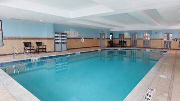 Indoor pool, open 7 AM to 11 PM, pool loungers
