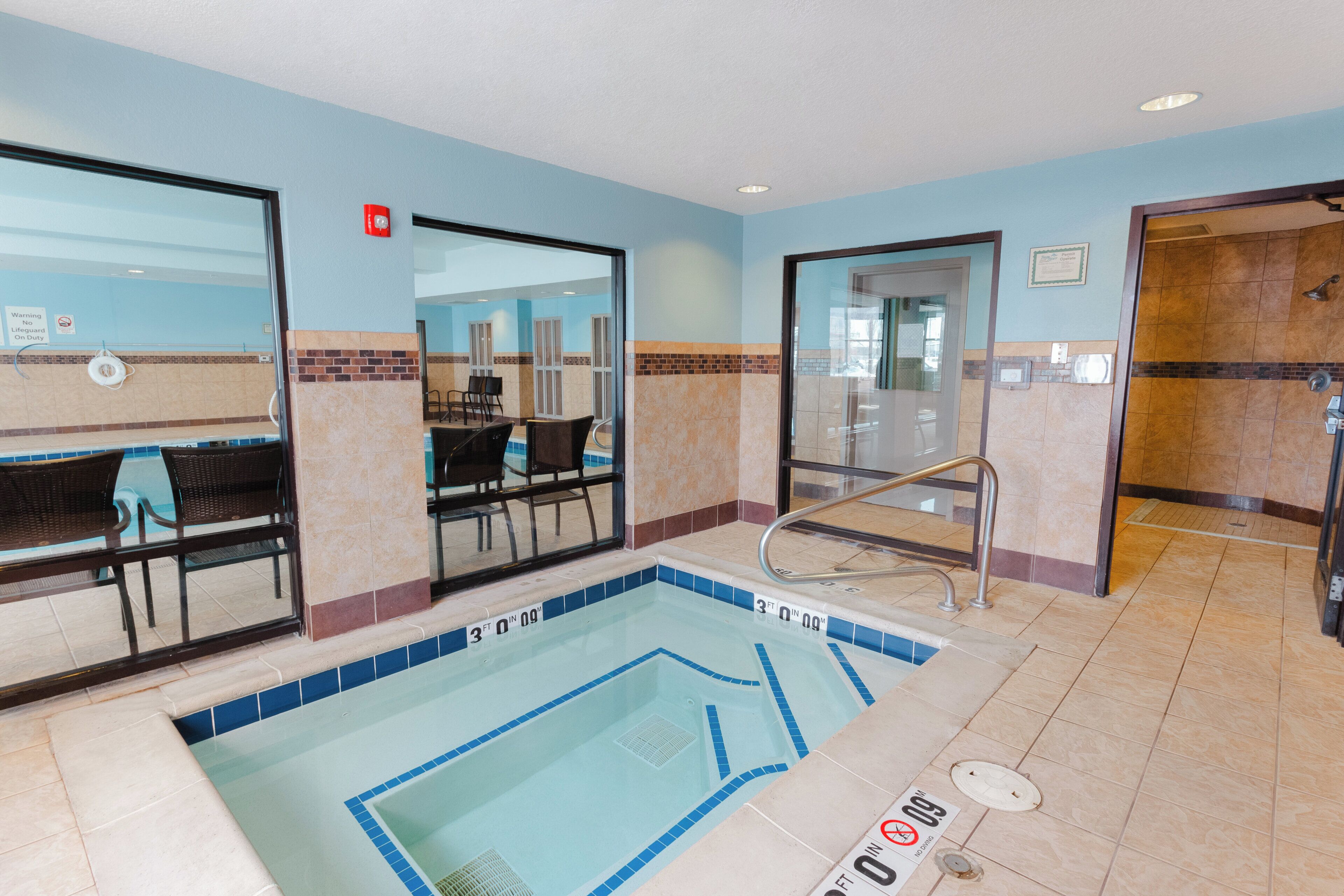 Indoor pool, open 7 AM to 11 PM, pool loungers