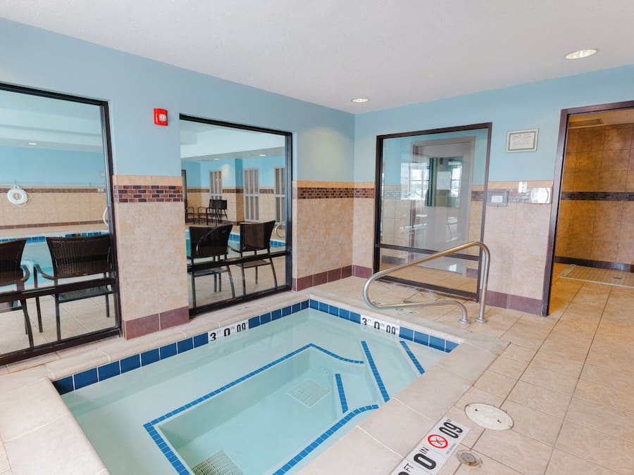 Indoor pool, open 7 AM to 11 PM, pool loungers