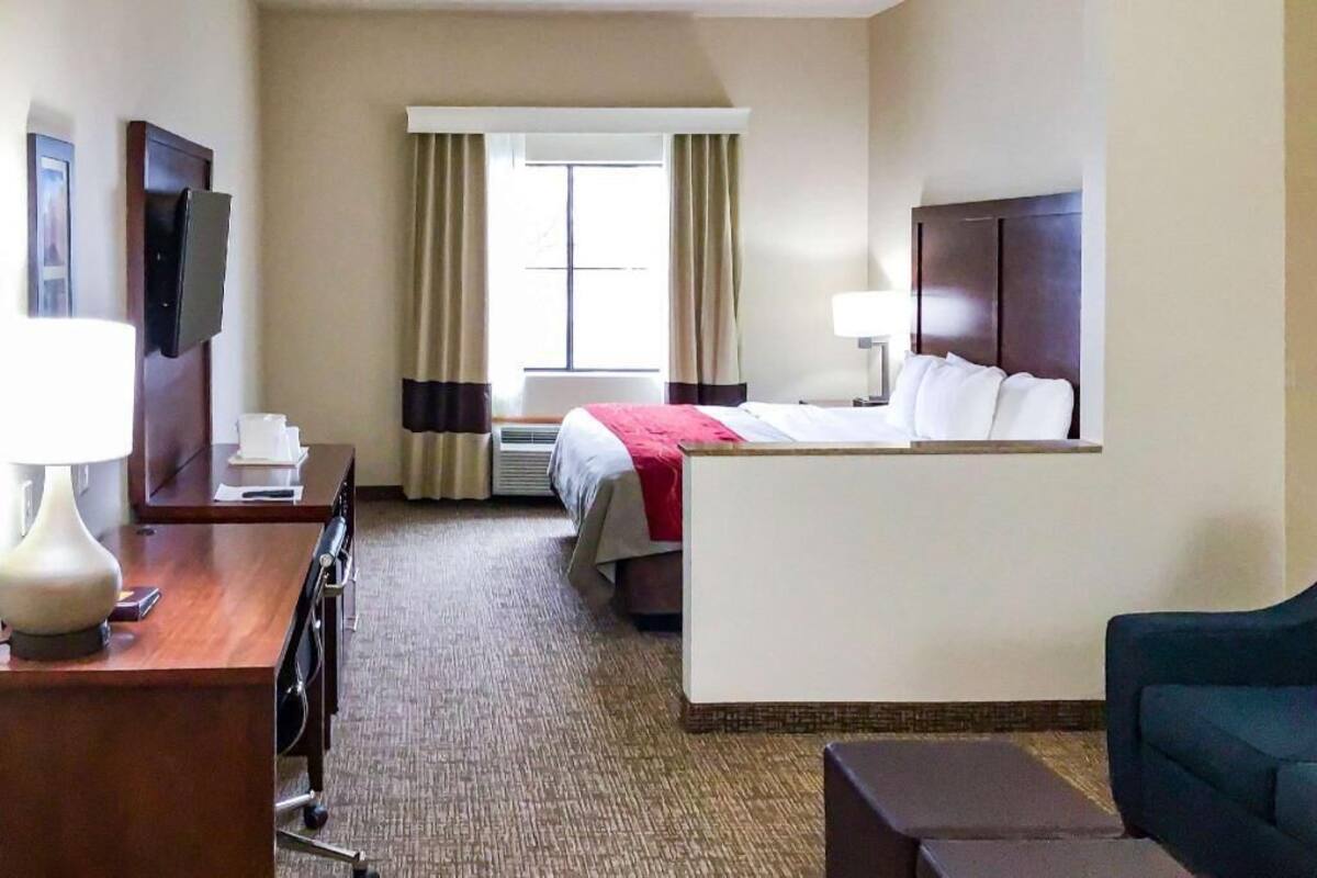 Premium bedding, laptop workspace, blackout drapes, iron/ironing board