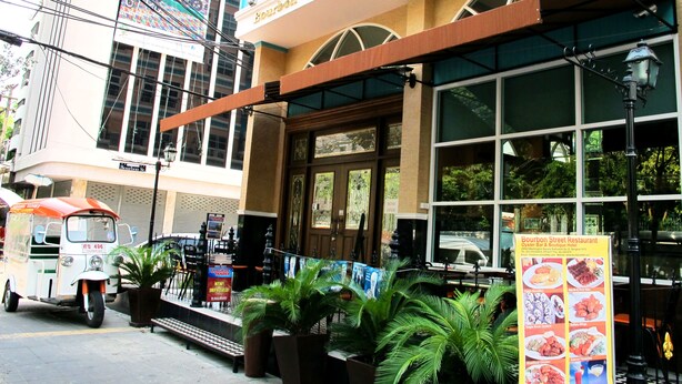 A restaurant with a sign reading "Bourbon St. Restaurant & Oyster Bar."