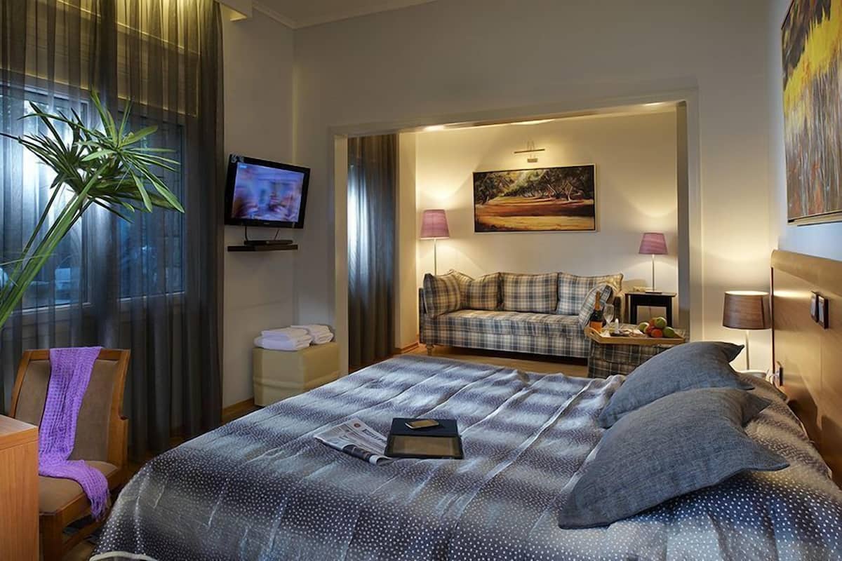 Executive Quadruple Room (Cocomat) | Minibar, in-room safe, iron/ironing board, free WiFi