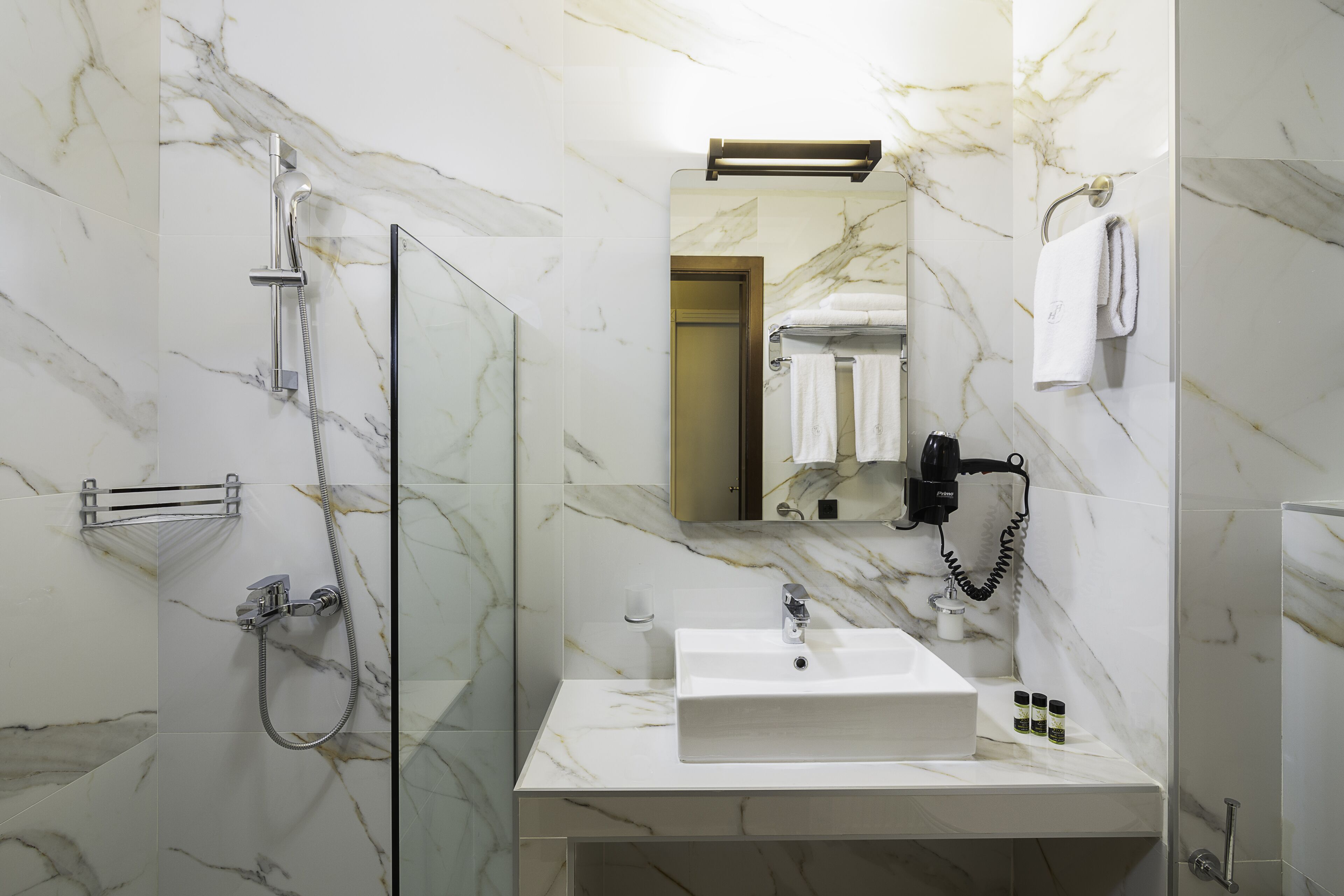 superior triple room | bathroom | shower, rainfall showerhead, free toiletries, hair dryer