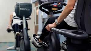 A stationary bike in a gym with a digital display and a mirror. - Holiday Inn Express San Jose Costa Rica Airport by IHG (Rio Segundo)