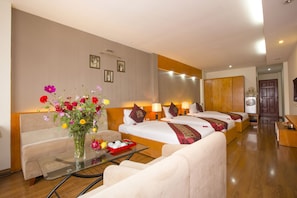 Family Quadruple Room, 1 Bedroom | Living area | 32-inch LCD TV with satellite channels, TV