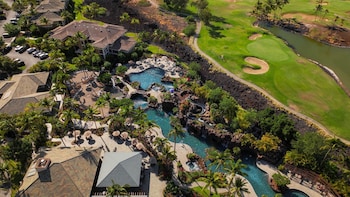 2 outdoor pools, pool umbrellas, sun loungers at Hilton Grand Vacations Club Kings
