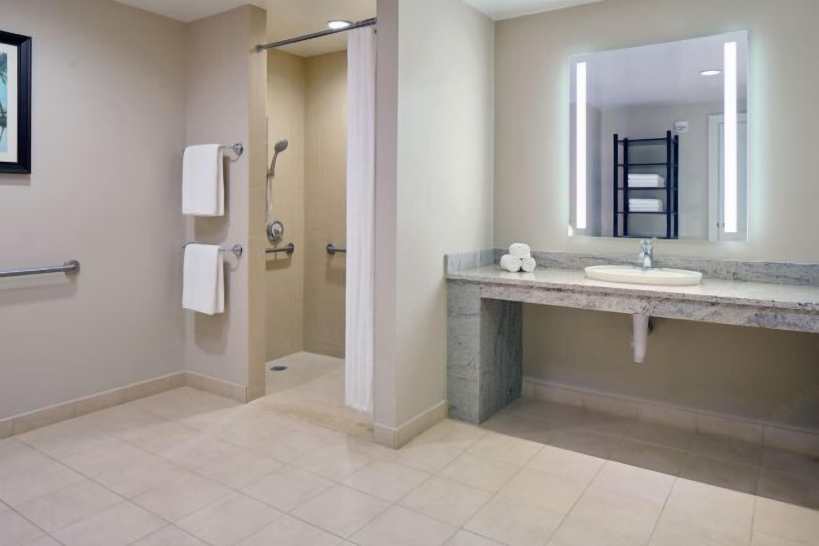 Designer toiletries, hair dryer, towels, shampoo