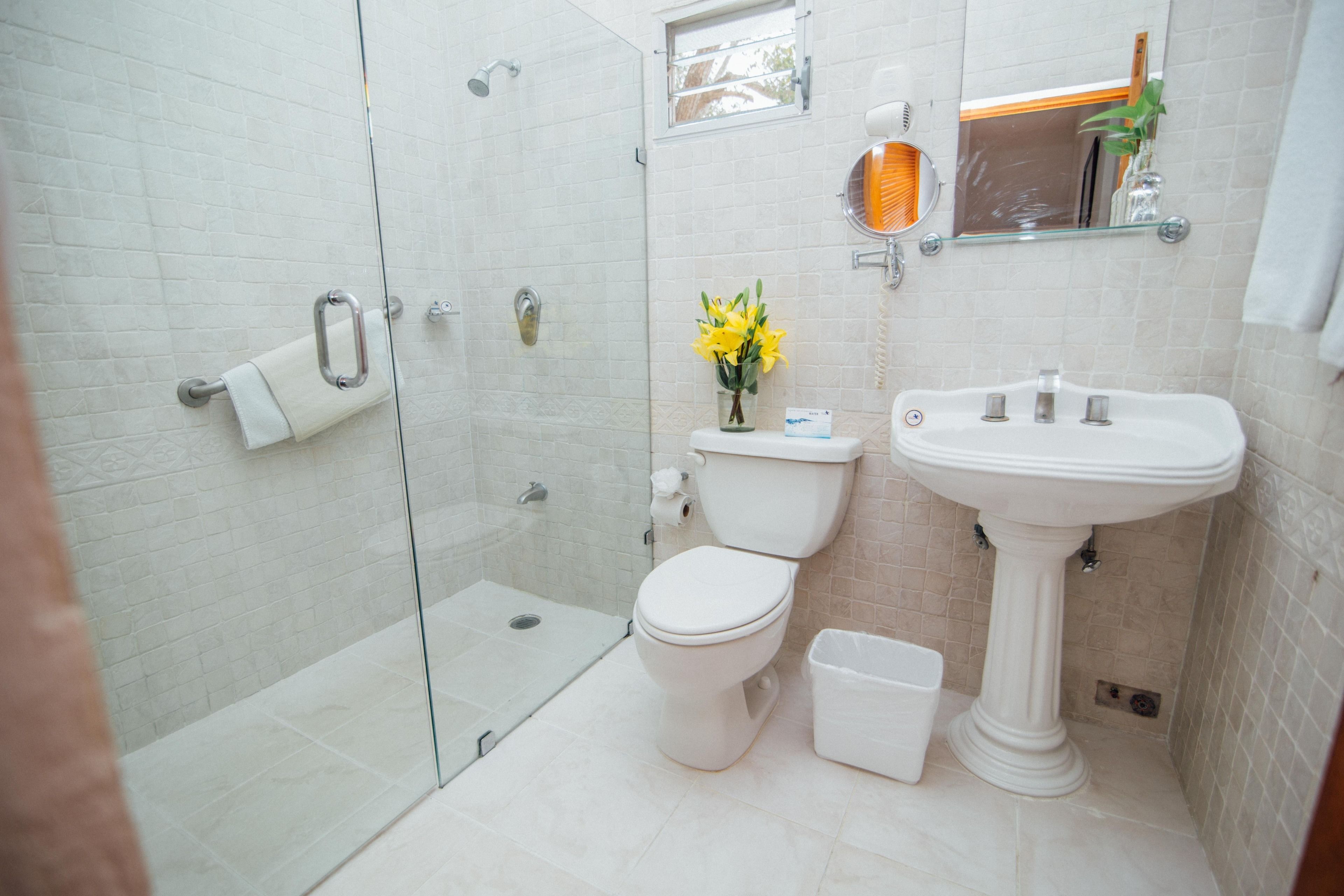 designer toiletries, hair dryer, towels, soap