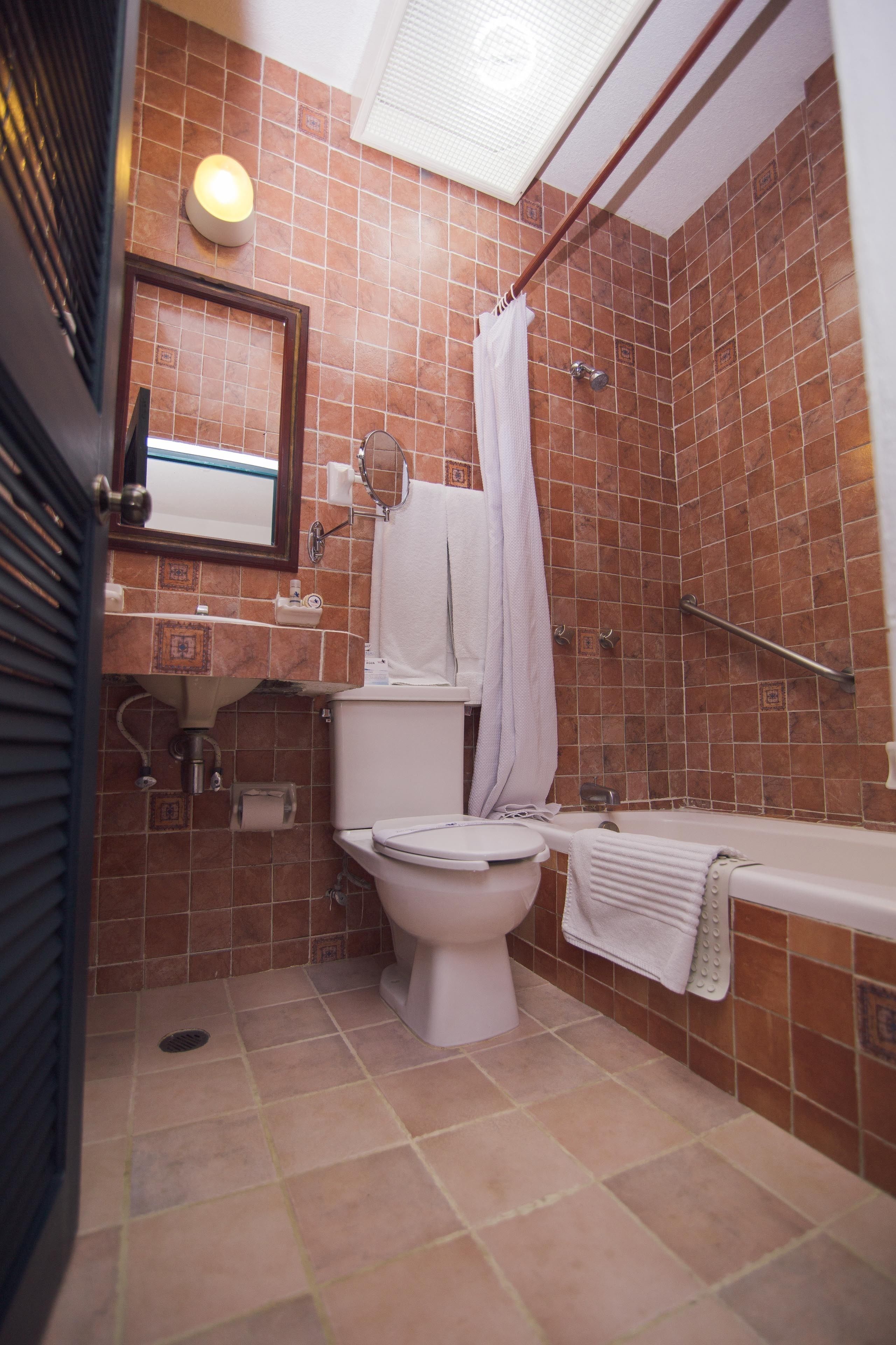 designer toiletries, hair dryer, towels, soap