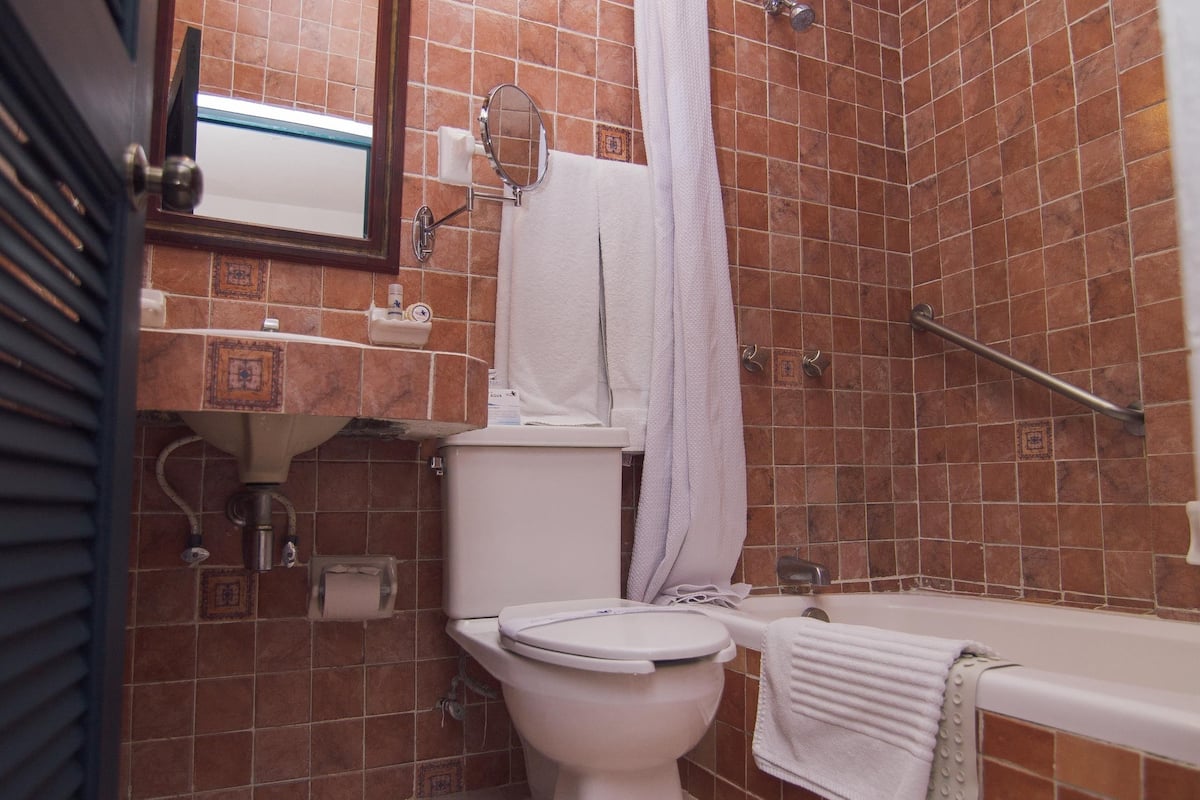 designer toiletries, hair dryer, towels, soap