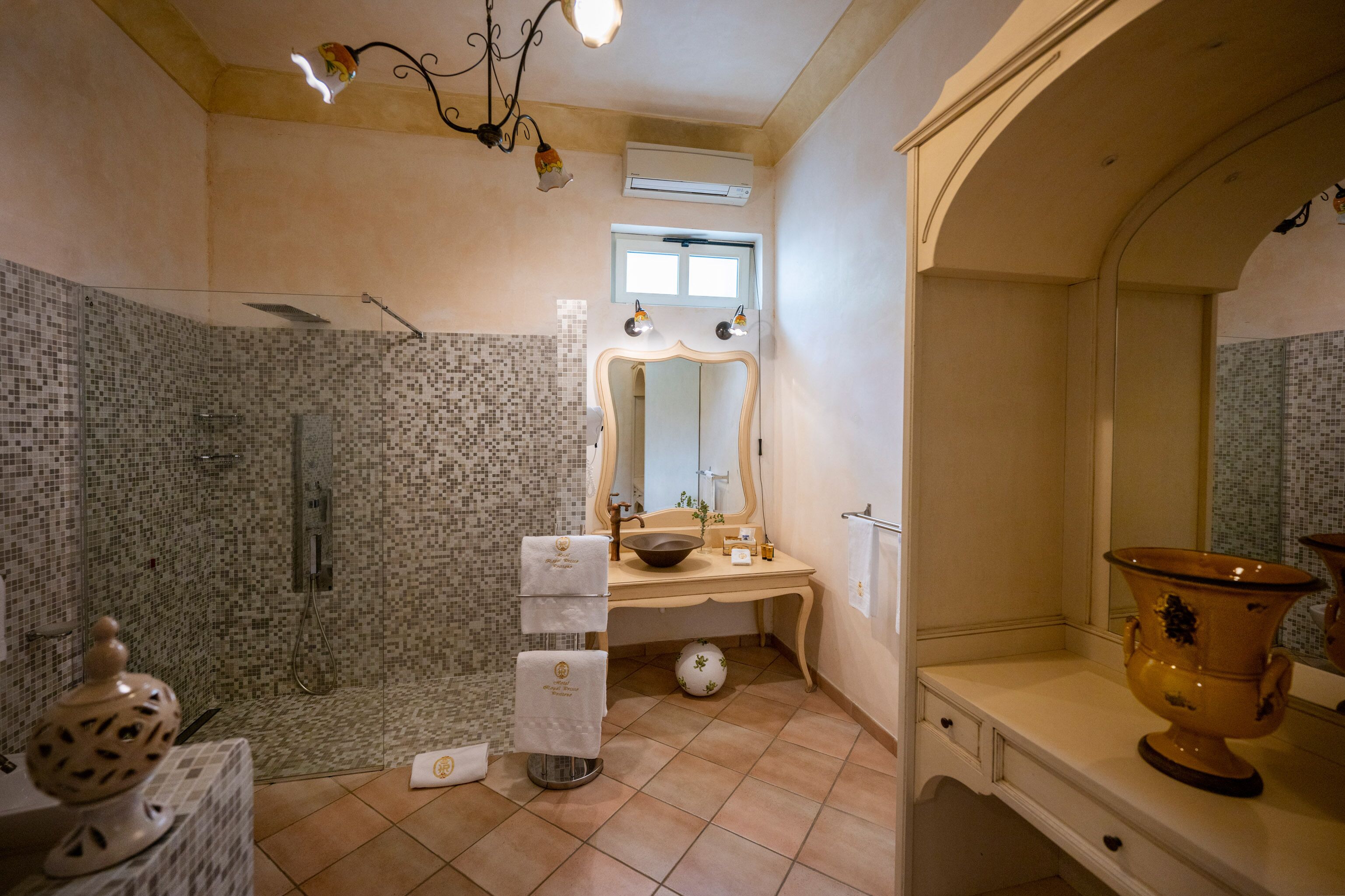 suite | bathroom | rainfall showerhead, hair dryer, bathrobes, slippers
