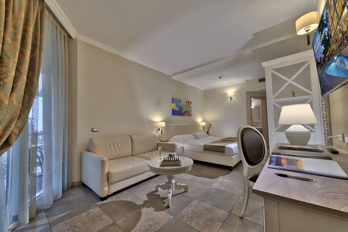 superior room, balcony, partial lake view | minibar, in-room safe, desk, laptop workspace