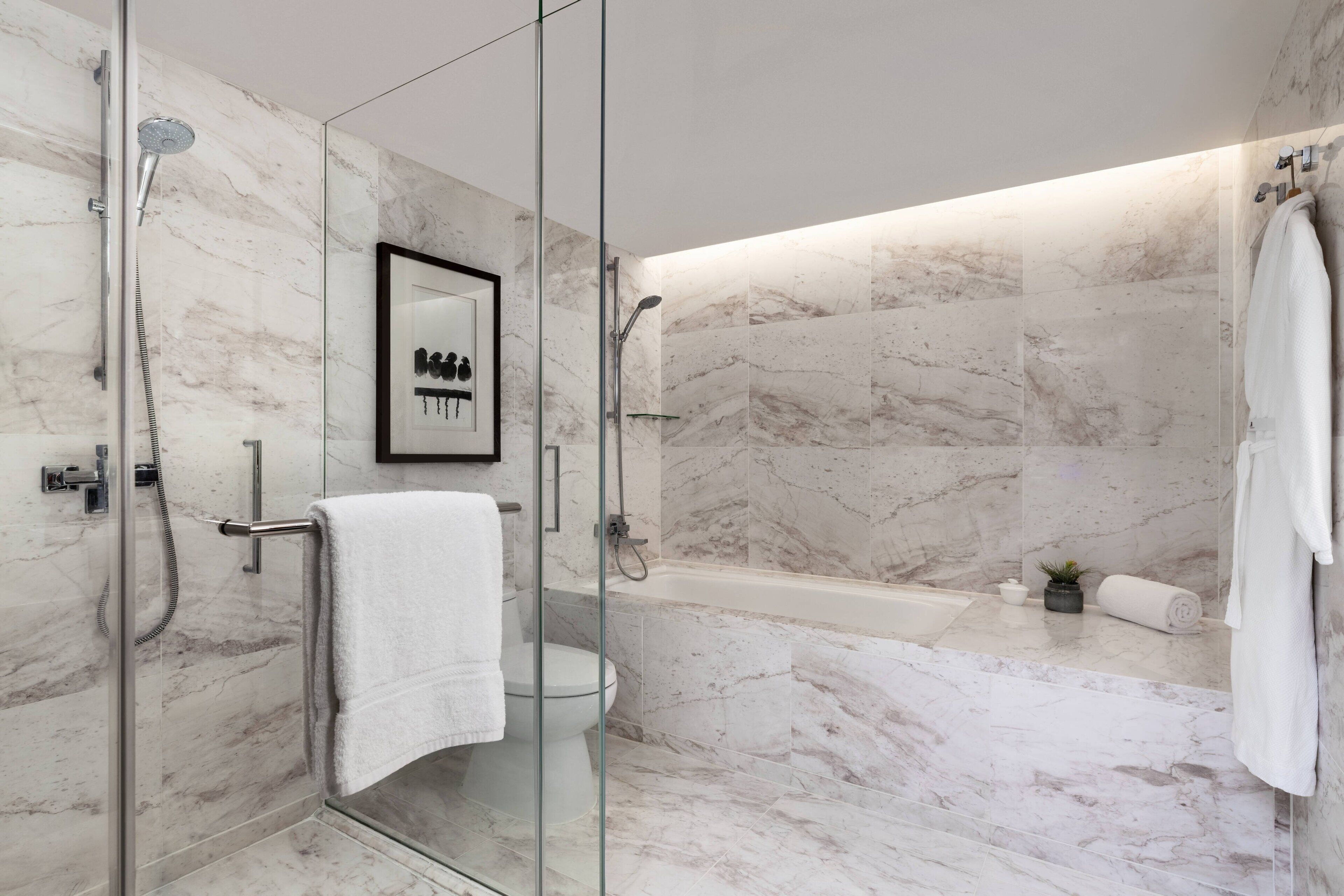 designer toiletries, hair dryer, bathrobes, slippers