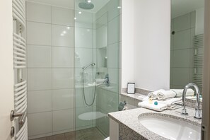 Shower, free toiletries, hair dryer, towels