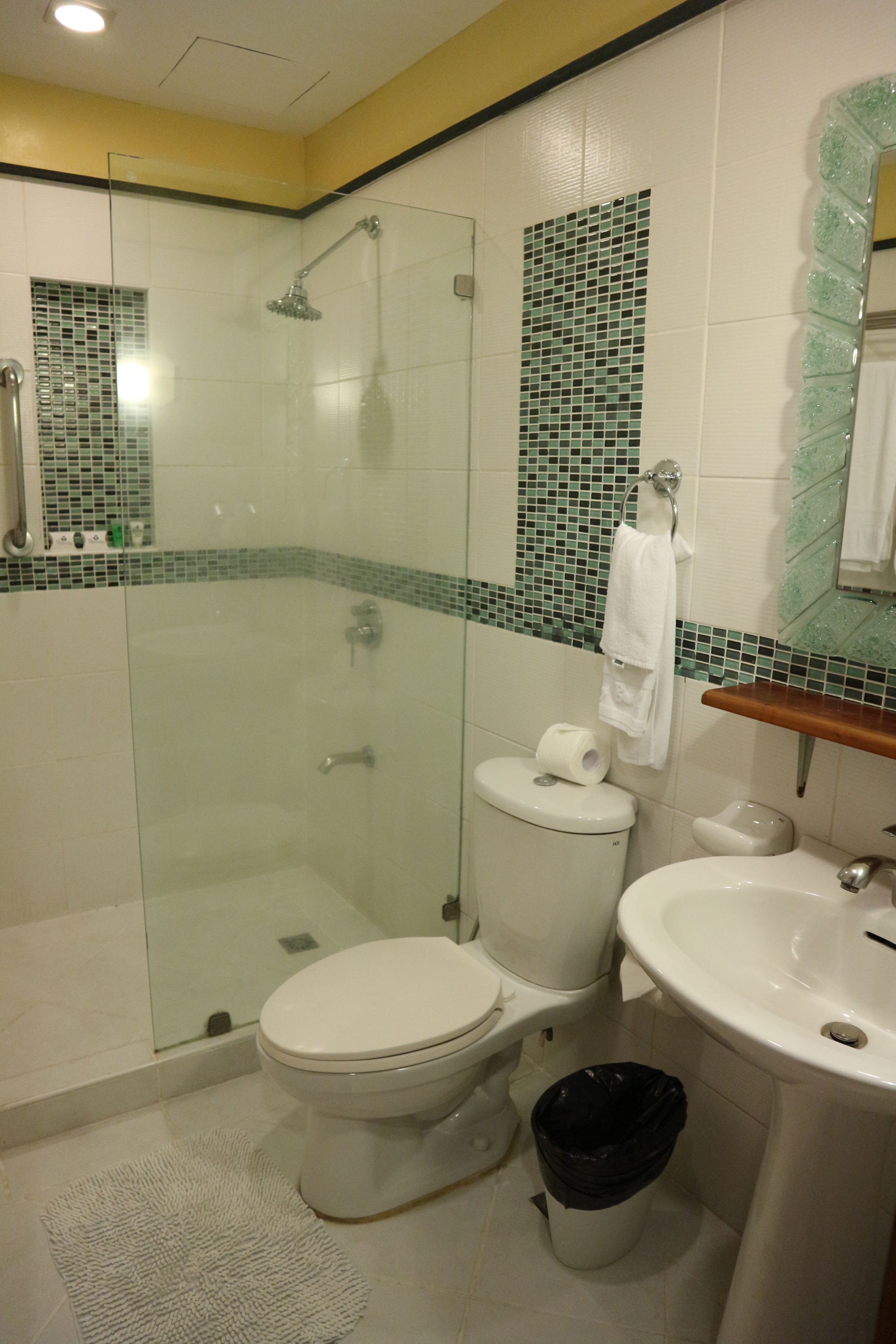 deluxe room, 2 queen beds | bathroom | shower, free toiletries, hair dryer, towels