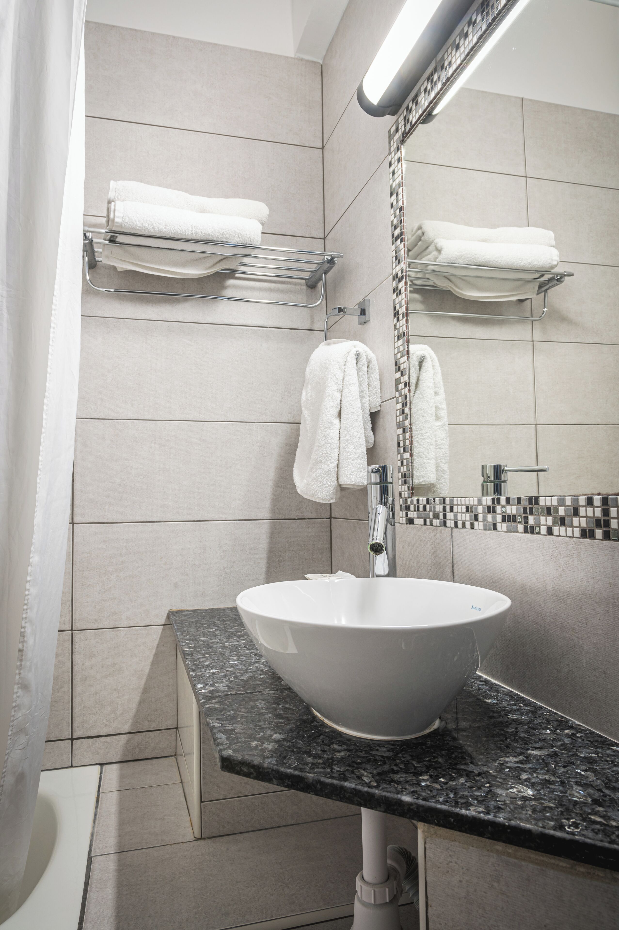 hair dryer, towels, soap, toilet paper