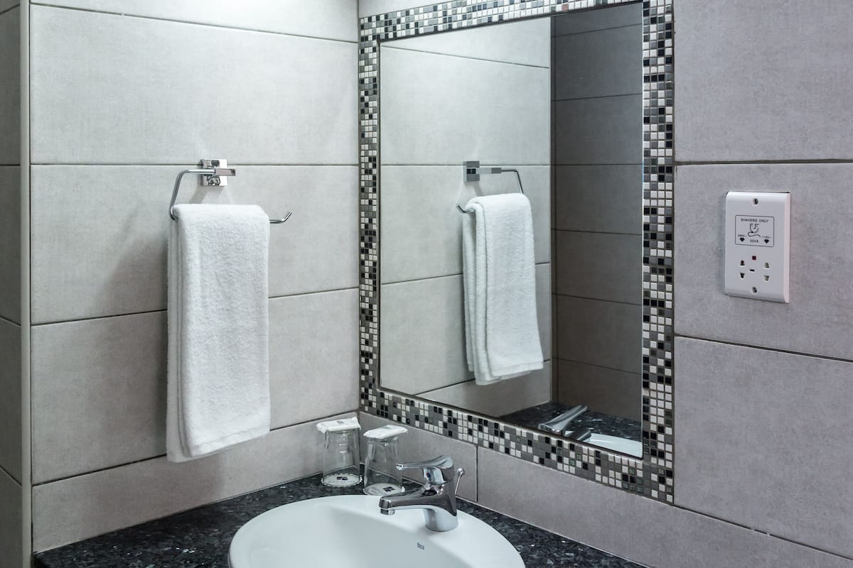 hair dryer, towels, soap, toilet paper