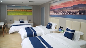 A hotel room with two beds, a desk, and a large wall painting of a sunset over a savannah landscape. - Grand Golden Phoenix (Beijing)