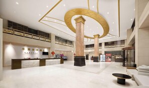 A spacious lobby with a reception desk, seating area, and a staircase leading to an upper level. - Grand Golden Phoenix (Beijing)
