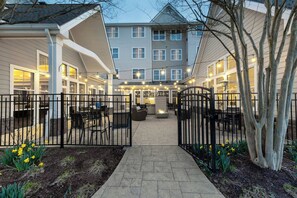 A courtyard with outdoor seating, a fire pit, and a gated entrance. - Residence Inn by Marriott Fredericksburg (Fredericksburg)