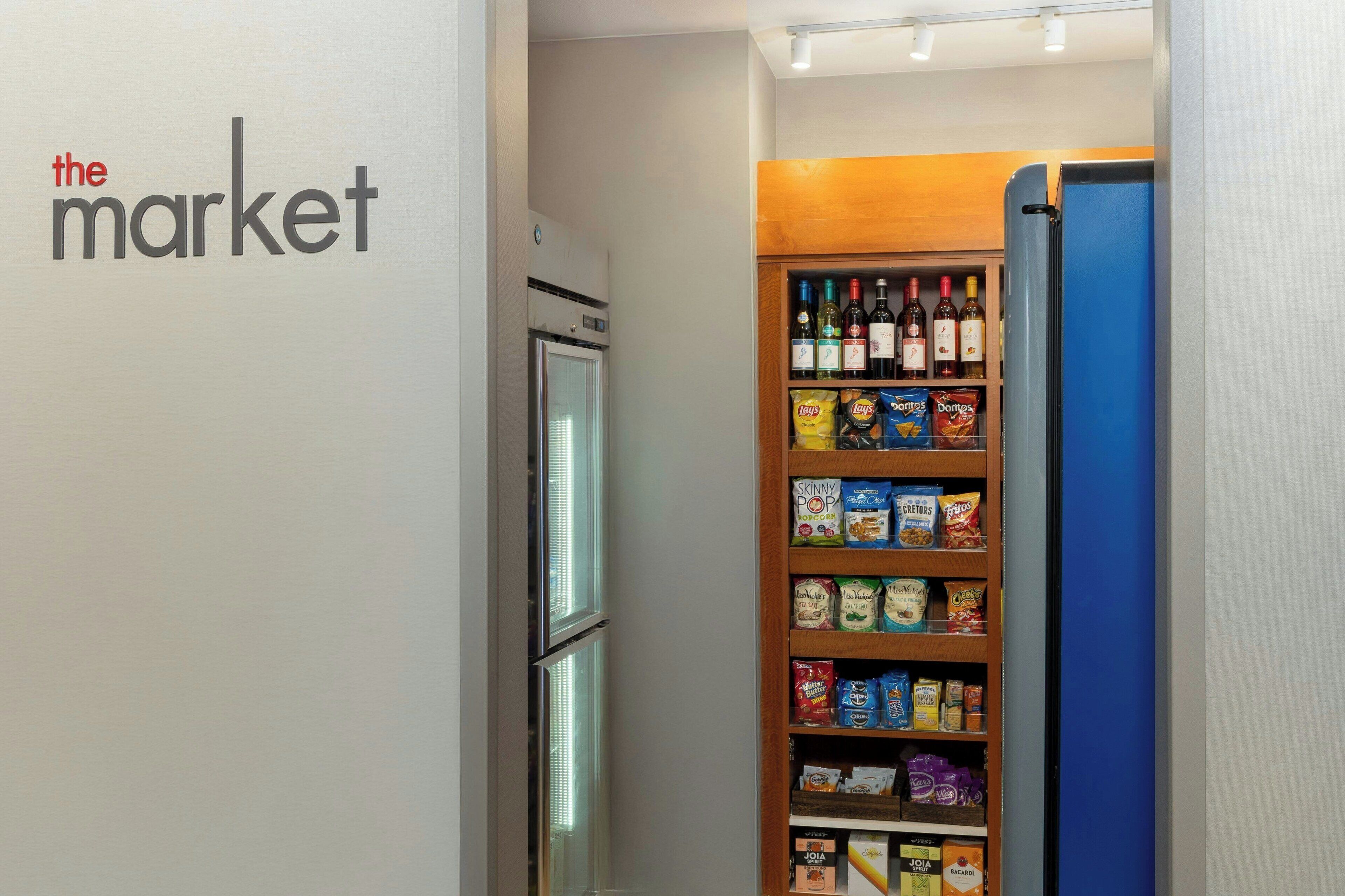 A storage area with shelves stocked with snacks, beverages, and other items.