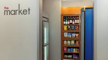 A storage area with shelves stocked with snacks, beverages, and other items.