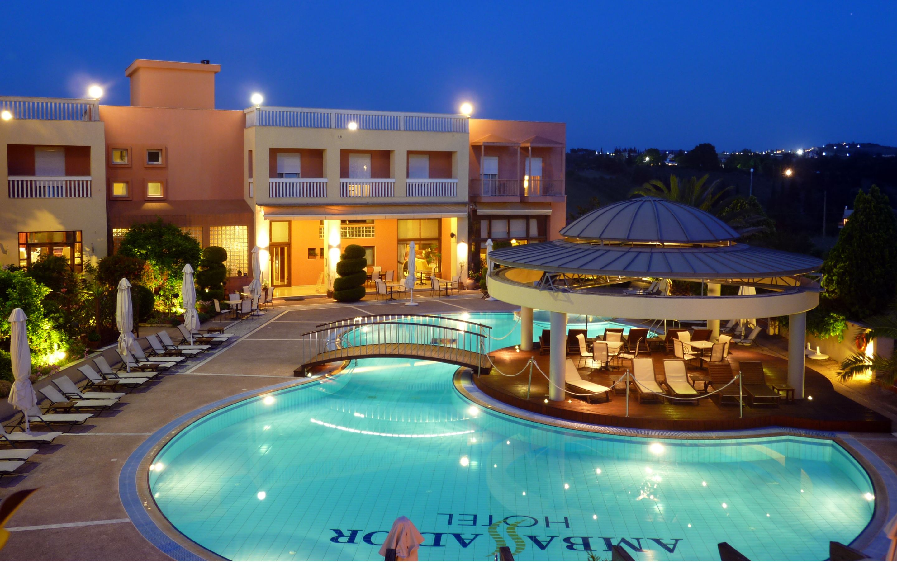 seasonal outdoor pool, open 10 am to 8 pm, pool umbrellas, pool loungers