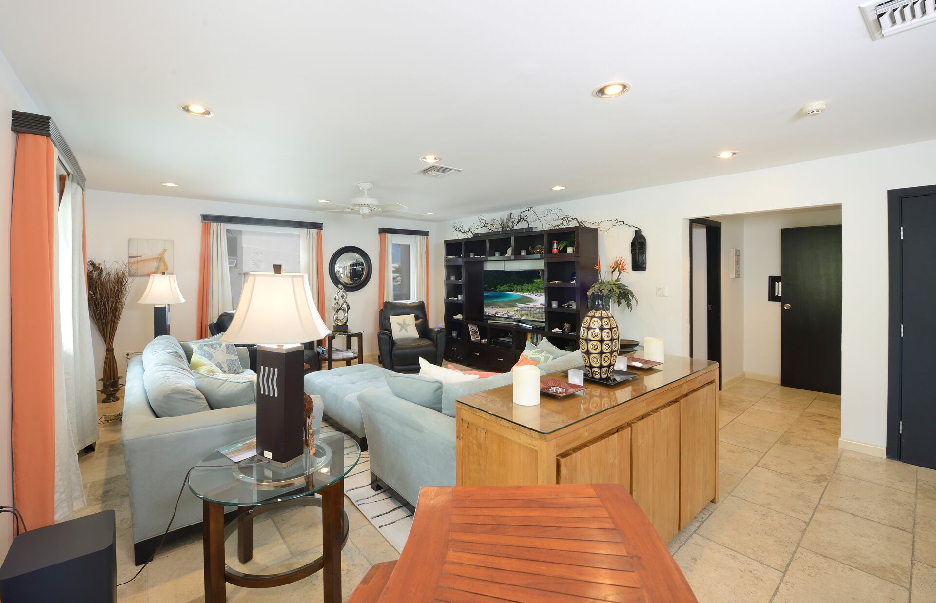 condo, 1 king bed with sofa bed, lagoon view | living area | 50-inch flat-screen tv with satellite channels, tv, books