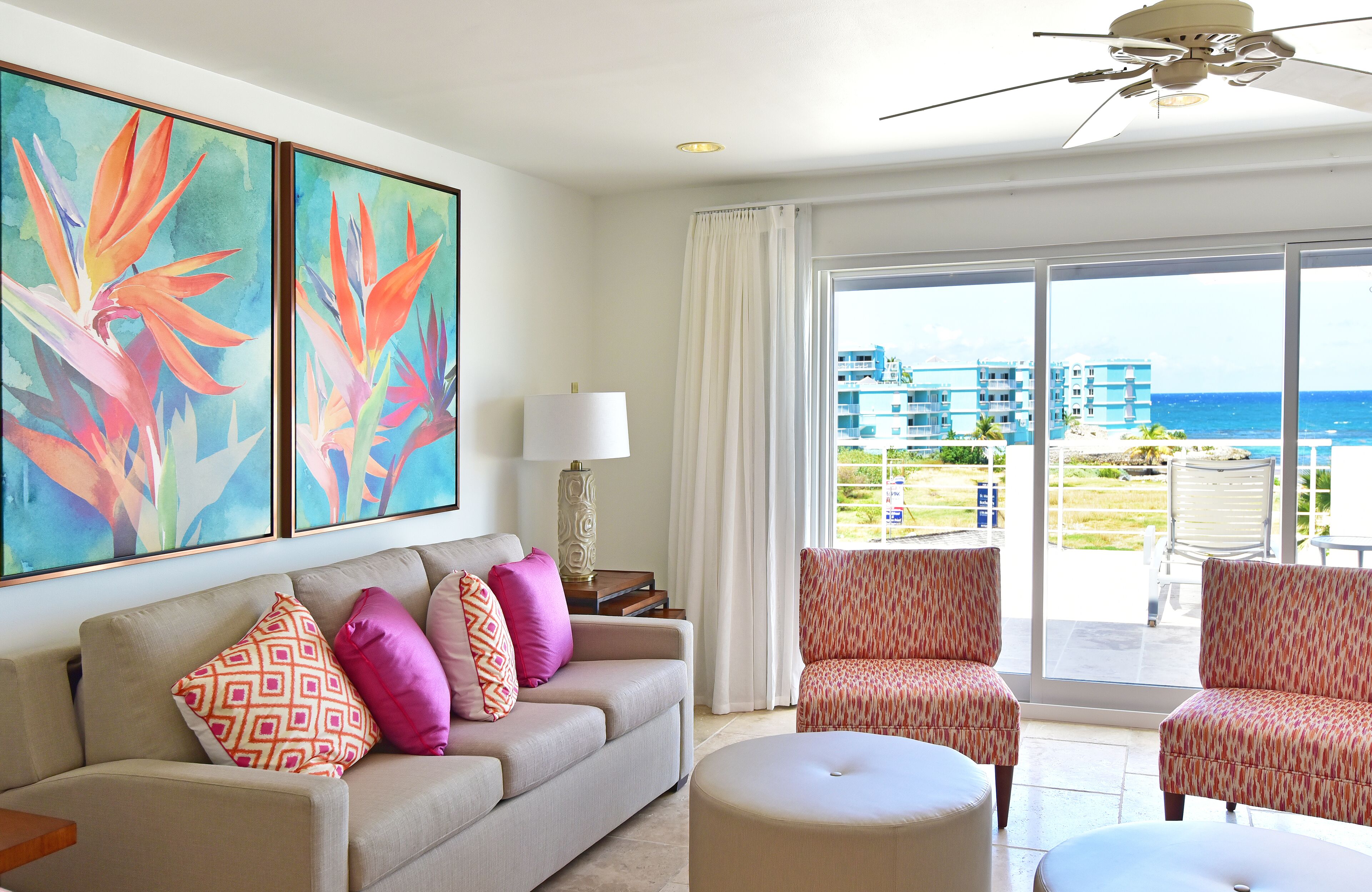 penthouse, 2 bedrooms, ocean view | living room | 50-inch flat-screen tv with satellite channels, tv, books