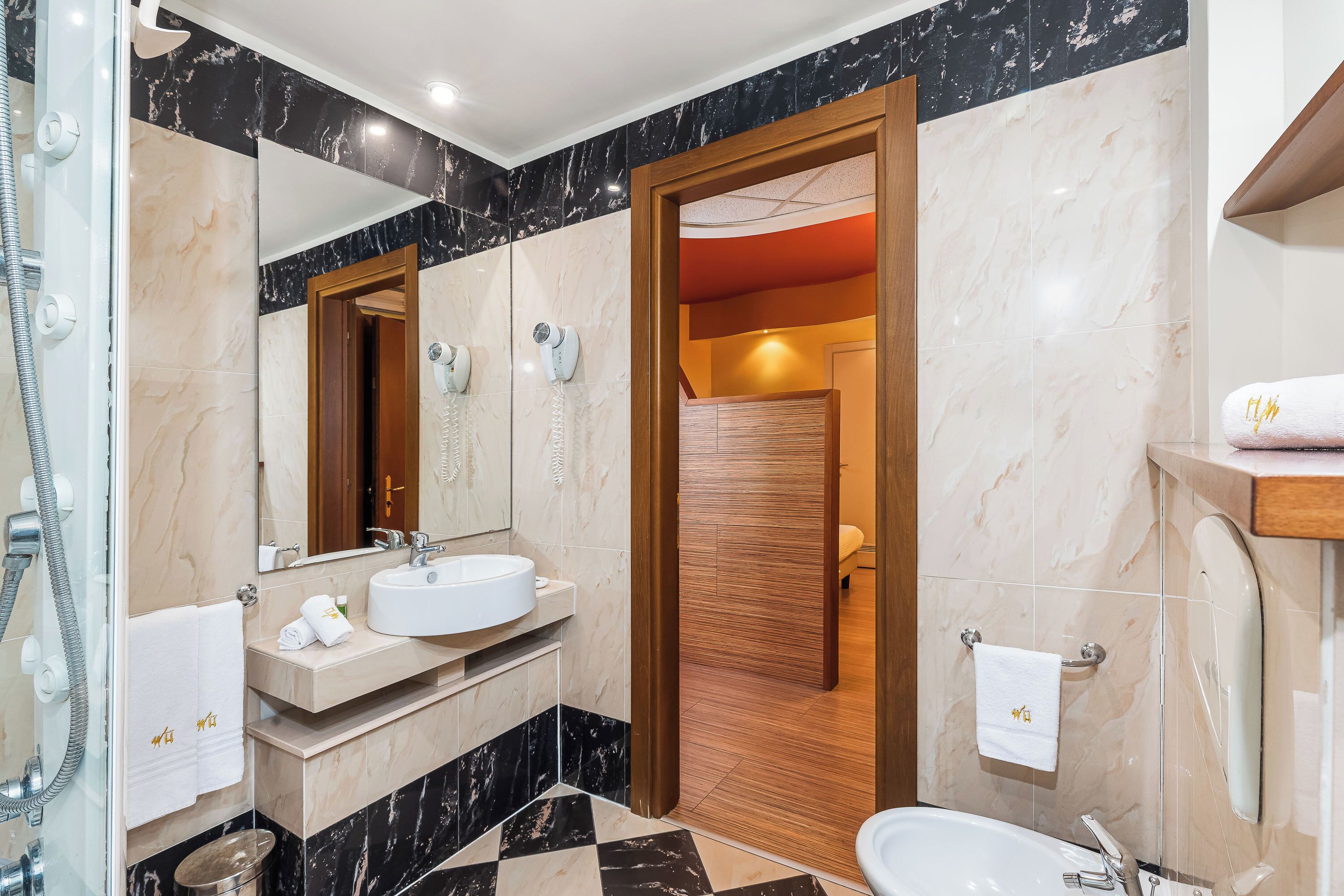 suite | bathroom | hair dryer, bidet, towels