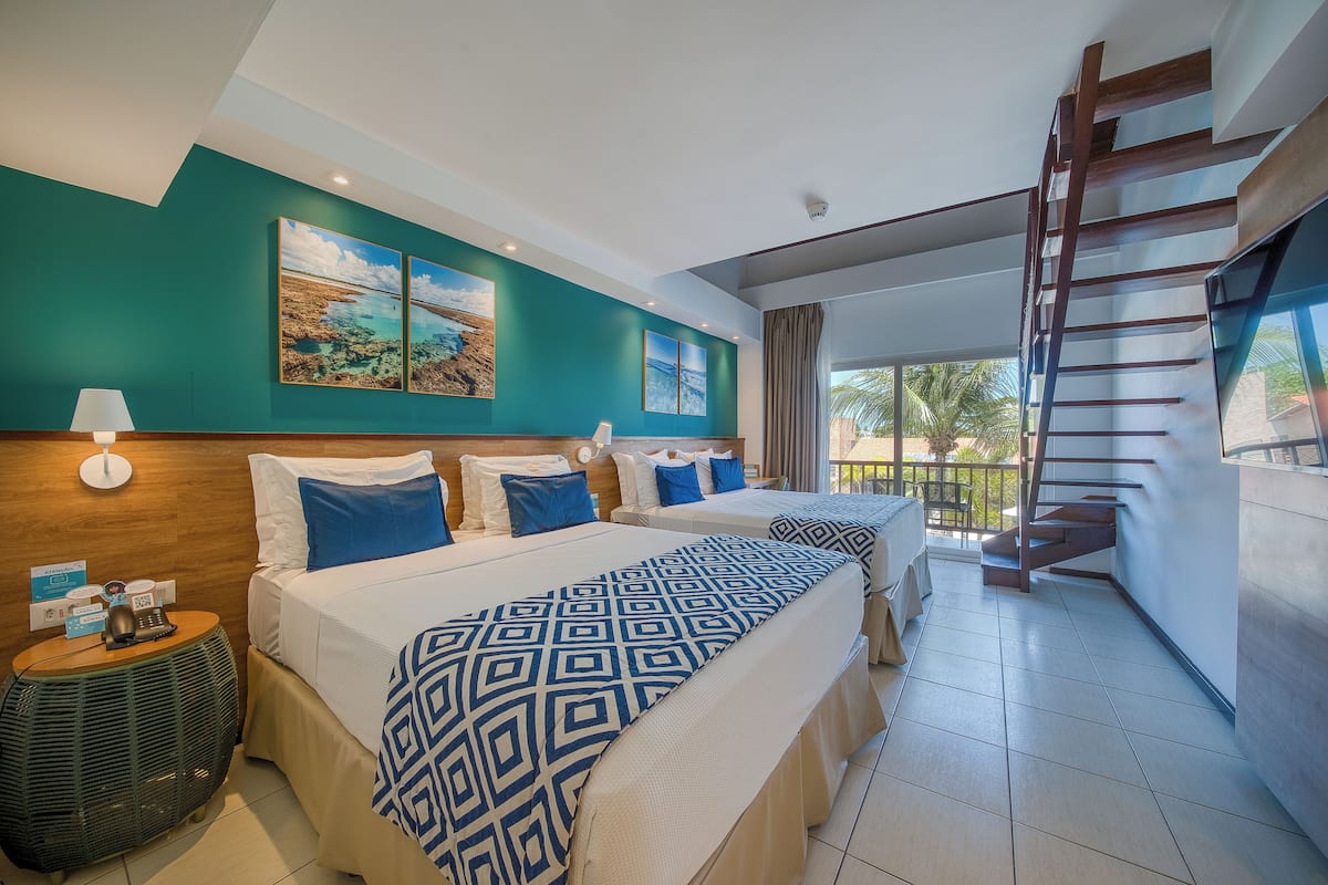 Family Room | Minibar, in-room safe, individually decorated, desk