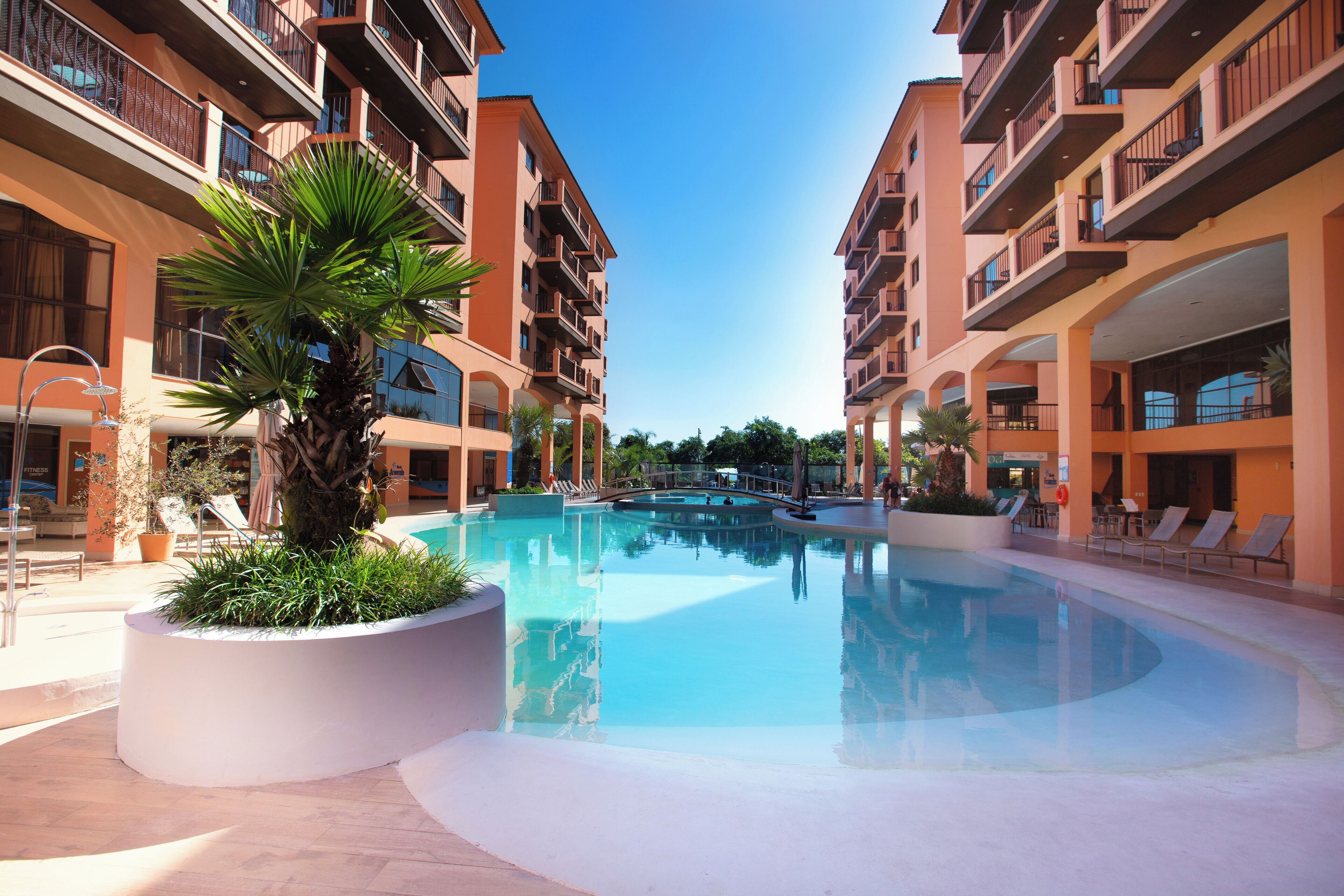 outdoor pool, pool umbrellas, pool loungers