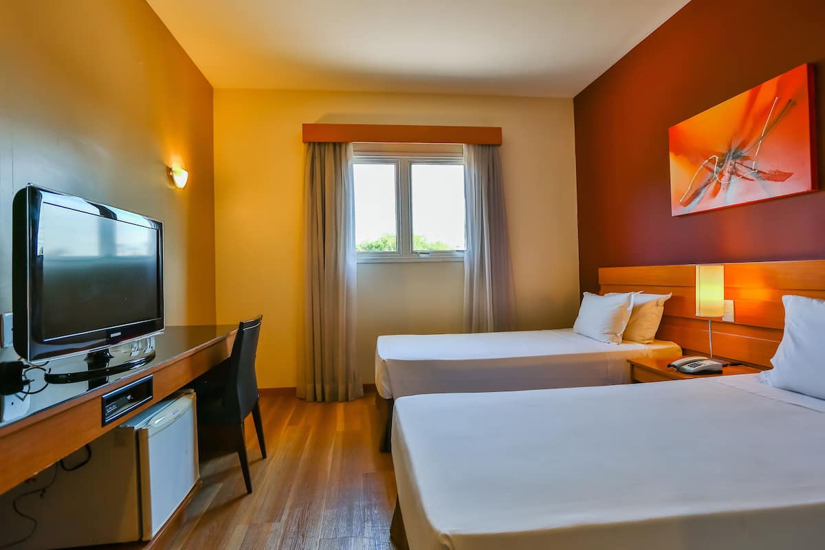 Standard Twin Room, 2 Single Beds | Minibar, in-room safe, desk, soundproofing