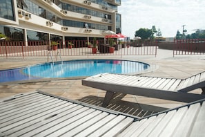 Outdoor pool, open 8:00 AM to 10:00 PM, pool umbrellas, pool loungers